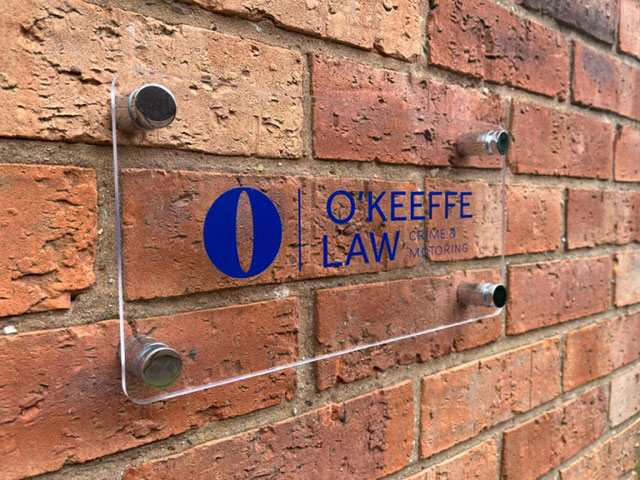 okeefe law sign on a wall